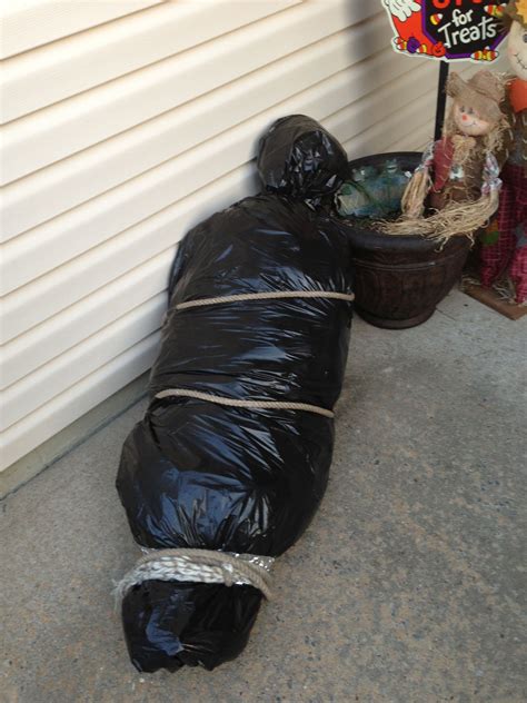 fake body bags for halloween|halloween dolls carrying body bag.